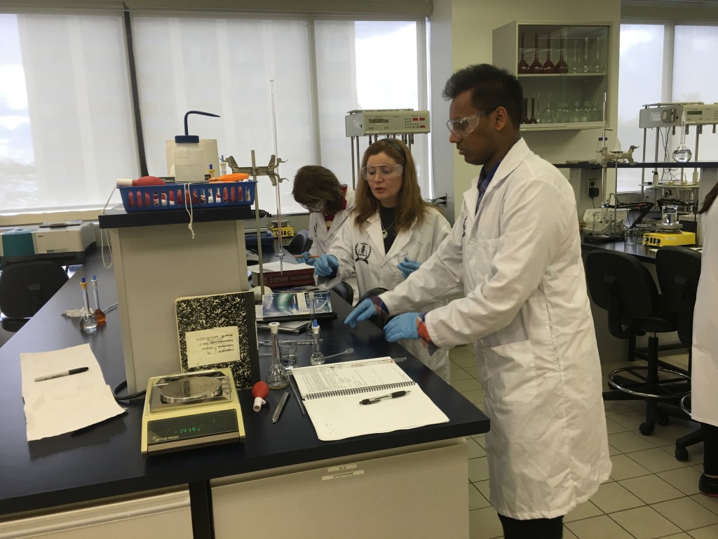 Students preparing sample solutions for testing.