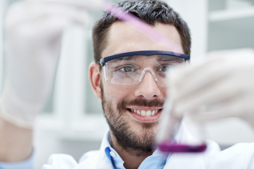 A student conducting microbiological tests in a quality control lab.