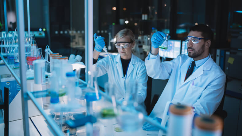 Analytical chemists examining a product having graduated from pharmaceutical school