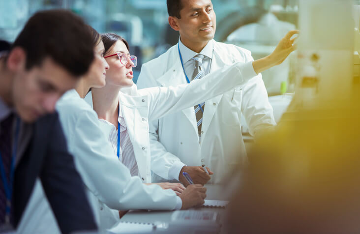 Budding clinical research professionals discuss clinical matters with their colleagues
