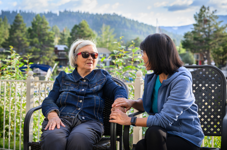 A PSW providing companionship and support to a long-term care resident.