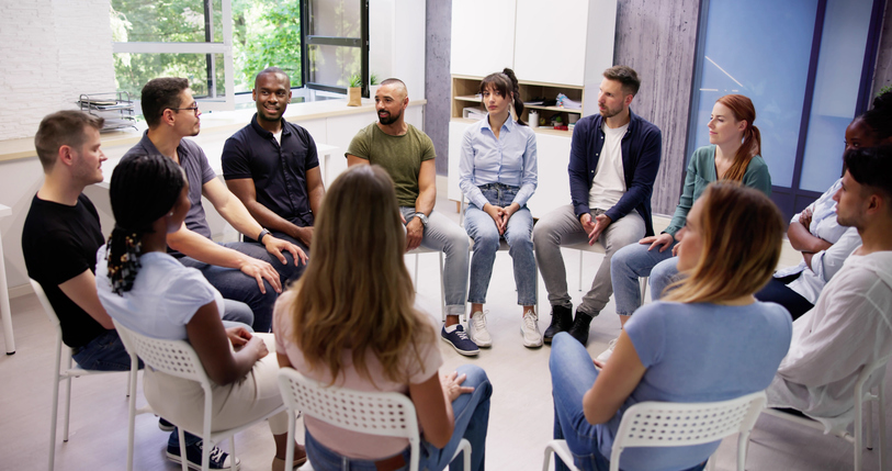 Students in a Personal Support Worker Program learning caregiving techniques.