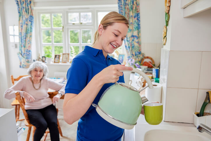 A personal support worker providing home care services after completing her personal support worker certificate