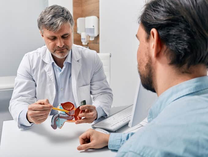A doctor explaining to a patient the effect on male reproduction health from the use of cannabis products as seen in cannabis industry training.