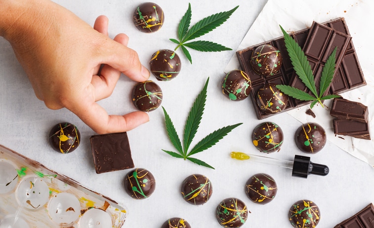 A doctor holding a cannabis edible after cannabis industry training