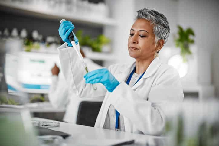 A female clinical research professional in a lab after clinical research training