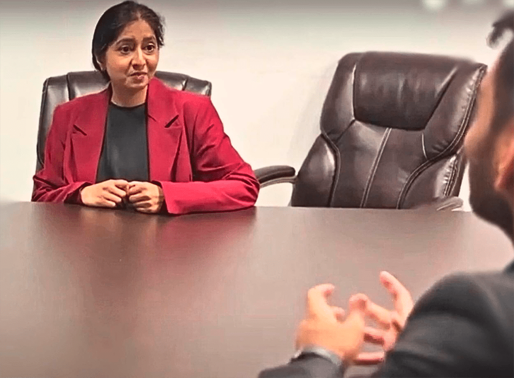 Asha having a discussion with a member of our career support team after completing her clinical research training