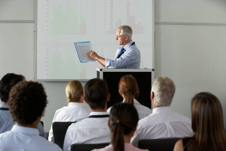 An instructor explaining the document review process in pharma QA training