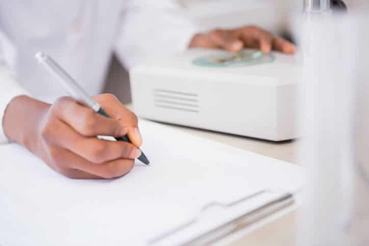 A Pharma lab technician working on HPLC documentation