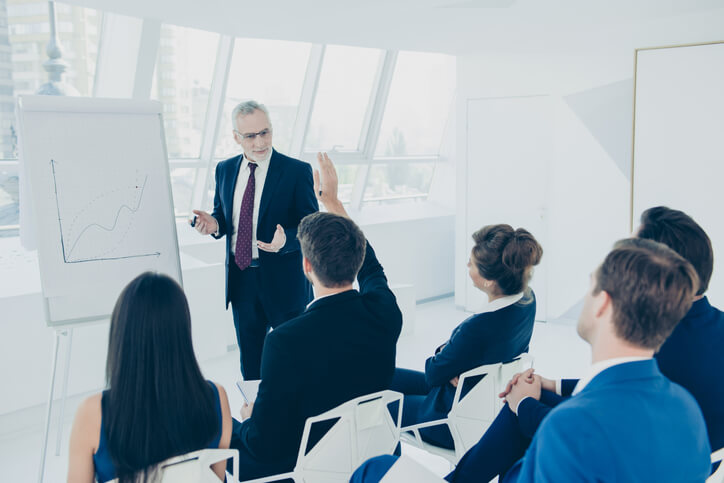 A class of employed individuals receiving industry-specific pharmaceutical training at AAPS.