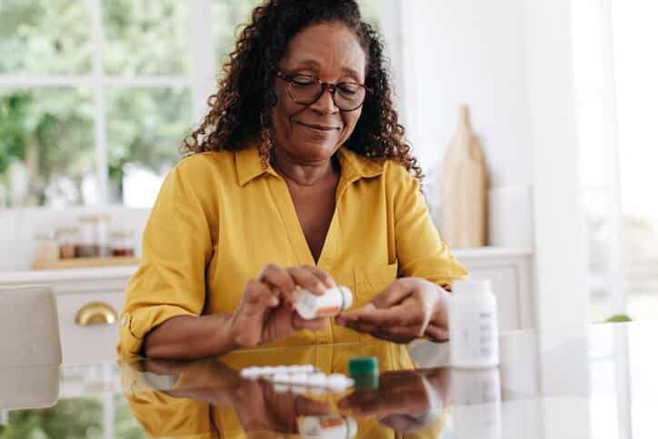 A patient taking medication verified by a pharmaceutical school graduate through pharmacovigilance.