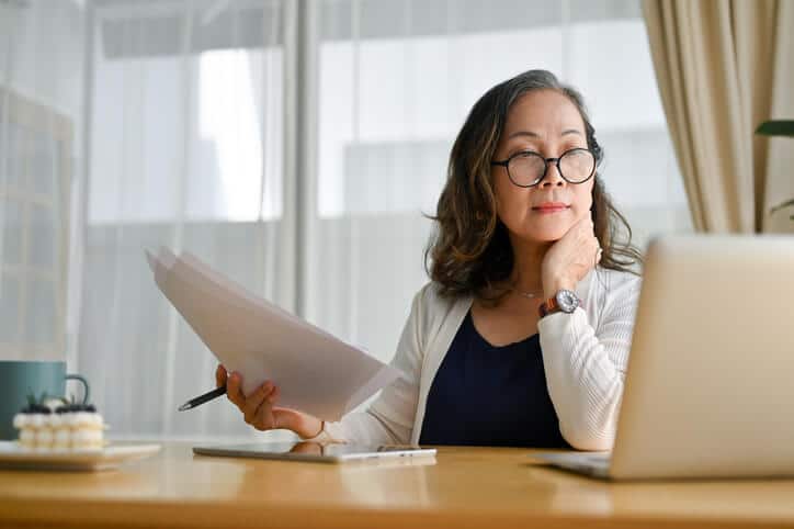 A female quality assurance professional reviewing work