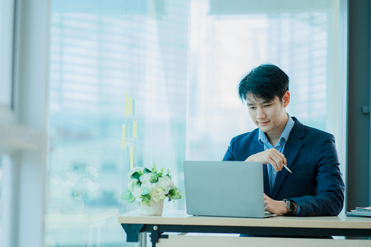 A male regulatory affairs professional attending a regulatory affairs training webinar online