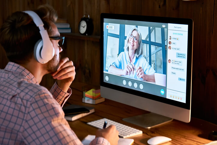 A male regulatory affairs professional taking in a comprehensive online pharmaceutical training webinar
